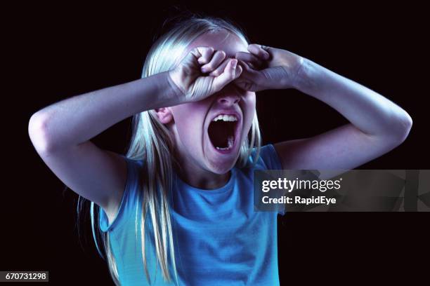 little girl mouth open, hands covering eyes: sleepy or furious - girls open mouth imagens e fotografias de stock