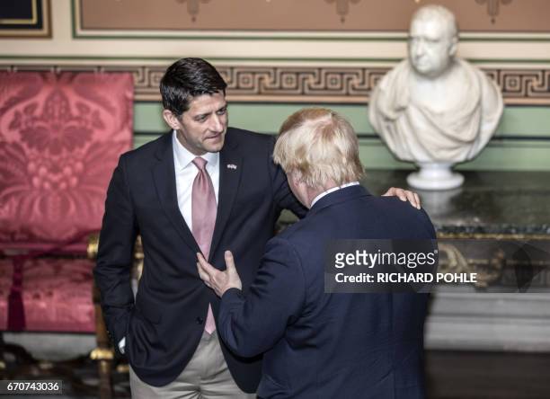 Britain's Foreign Secretary, Boris Johnson chats with Republican House Speaker, Paul Ryan at the Foreign Office in London on April 20, 2017. / AFP...