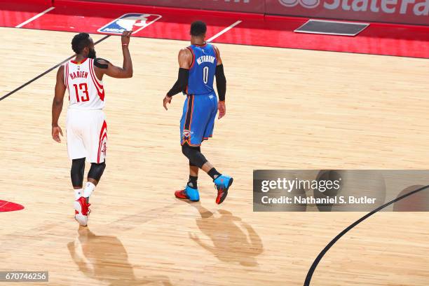 James Harden of the Houston Rockets and Russell Westbrook of the Oklahoma City Thunder walk up court during Game Two of the Western Conference...