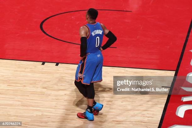 Russell Westbrook of the Oklahoma City Thunder stands on the court against the Houston Rockets during Game Two of the Western Conference...