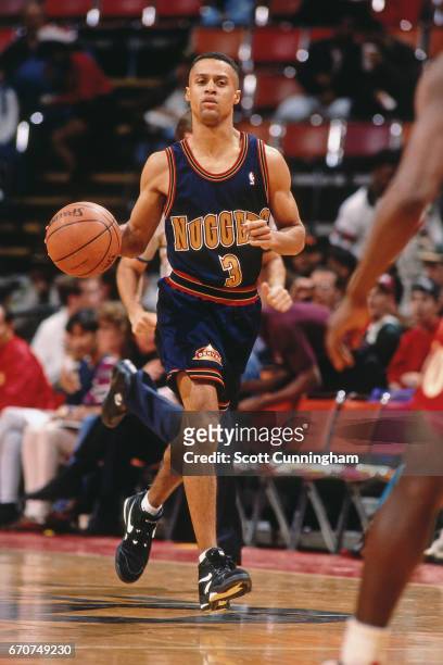 Chris Jackson of the Denver Nuggets dribbles against the Atlanta Hawks during a game played circa 1990 at the Omni in Atlanta, Georgia. NOTE TO USER:...