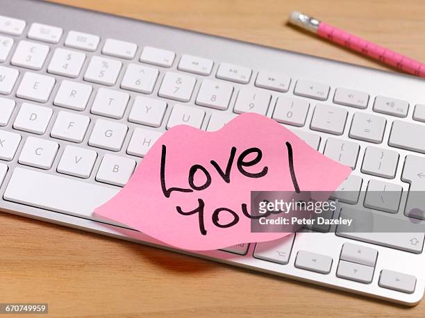 secret admirer romantic note left on office desk - work romance stock pictures, royalty-free photos & images
