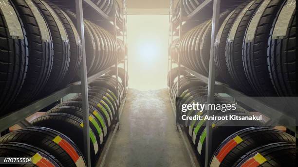 tire rubber products , group of new tires for sale at a tire store. - tyre stockfoto's en -beelden