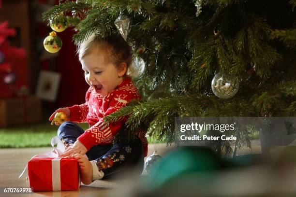 toddler girl with christmas tree - children christmas ストックフォトと画像