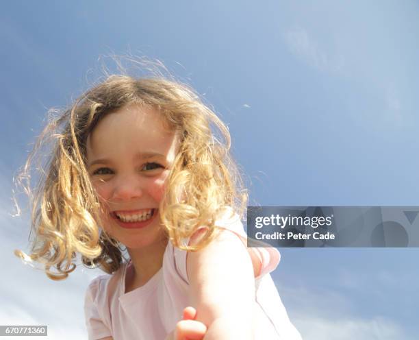 happy young girl in sunshine - 4 blond girls stock pictures, royalty-free photos & images