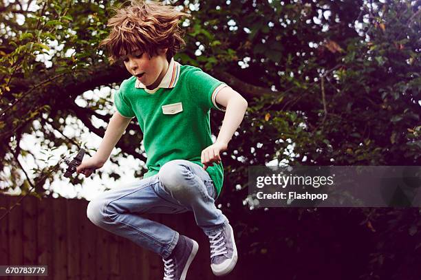 portrait of a happy child - boy jeans stockfoto's en -beelden