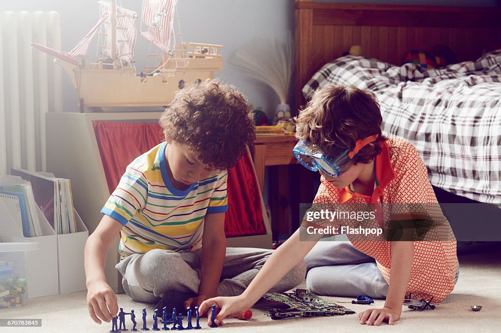 Two children working together to make things