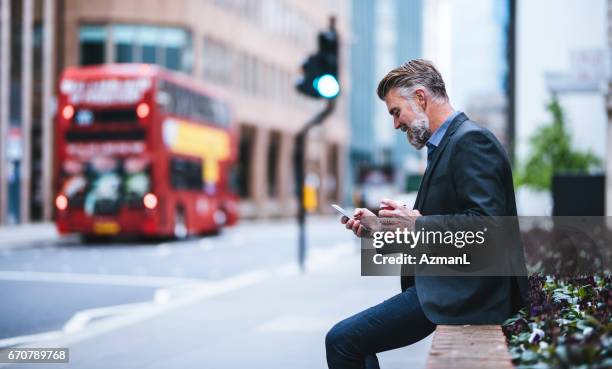 waiting for a collegue - double decker bus stock pictures, royalty-free photos & images
