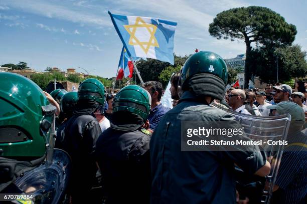 The protesters of the Jewish community of Rome with the flag of Israel blocked by police during the march for the Liberation of Nazi-fascism...