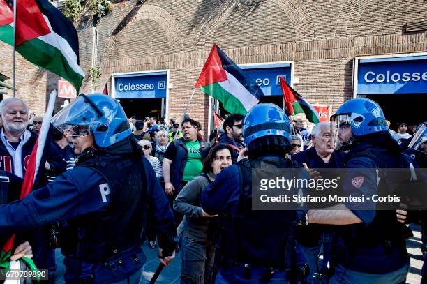 The police stop pro-Palestinian protesters during the march for the Liberation of Nazi-fascism organised by the National Association of Italian...