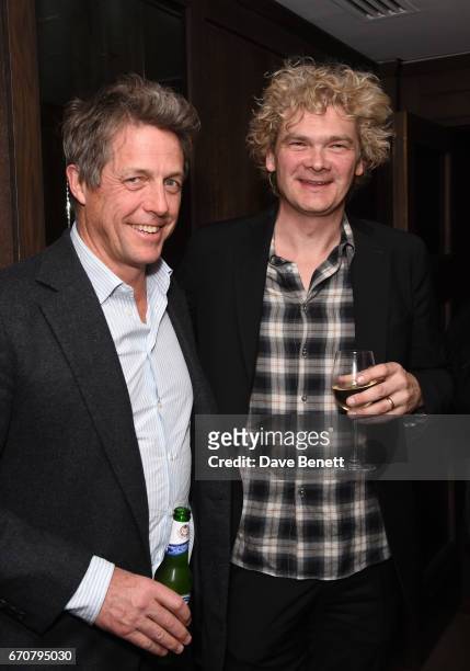 Hugh Grant and Simon Farnaby attend a gala screening of "Mindhorn" at the May Fair Hotel on April 20, 2017 in London, England.