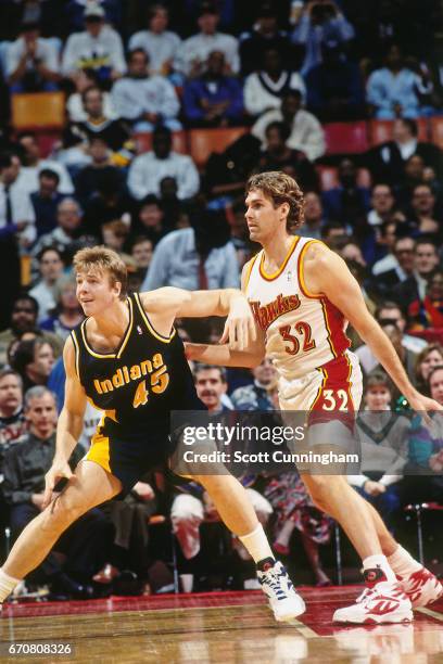 Rik Smits of the Indiana Pacers posts up against the Atlanta Hawks during a game played circa 1990 at the Omni in Atlanta, Georgia. NOTE TO USER:...