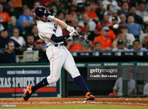 Jake Marisnick of the Houston Astros hits a home run in the fifth inning against the Los Angeles Angels of Anaheim at Minute Maid Park on April 20,...