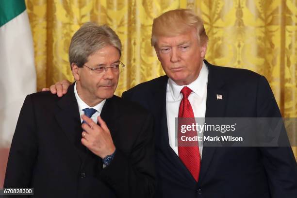 President Donald Trump and Prime Minister Paolo Gentiloni of Italy pose for a photo after a news conference in the East Room at the White House, on...