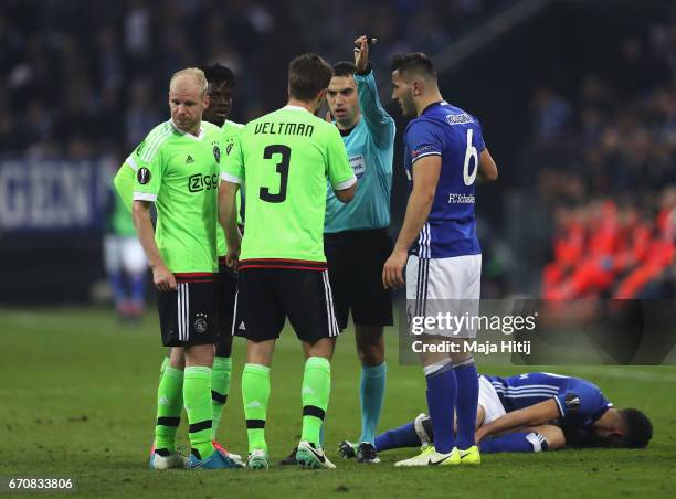 Joel Veltman of Ajax reacts as he is sent off by referee Ovidiu Hategan during the UEFA Europa League quarter final second leg match between FC...