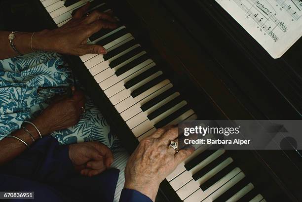 The hands of classical piano duo Margaret Patrick and Ruth Eisenberg , also known as Ebony and Ivory, performing in New Jersey, USA, June 1988. The...