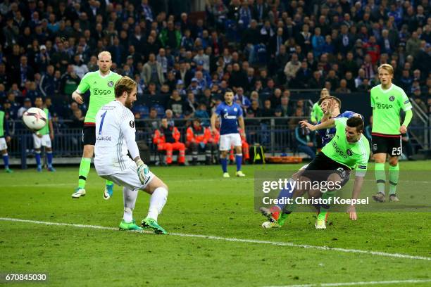 Nick Viergever of Amsterdam scores the first goal for Ajax against Ralf Faehrmann of Schalke during the UEFA Europa League quarter final second leg...