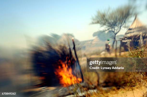 African Union soldiers find the village of Tama freshly burning more than a week after it was originally attacked by Arab Nomads backed by government...