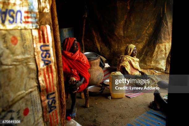 Women cook dinner during a wedding celebration in Hamsa Dakika camp in Zallingi, in West Darfur, March 3, 2007. Though most of Darfur continues to be...