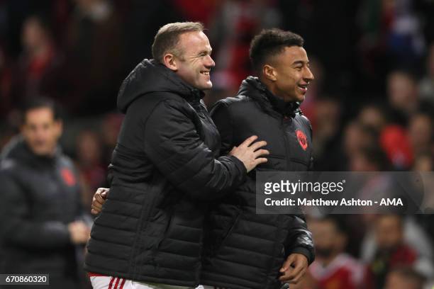 Wayne Rooney and Jesse Lingard of Manchester United celebrate at the end of the UEFA Europa League quarter final second leg match between Manchester...