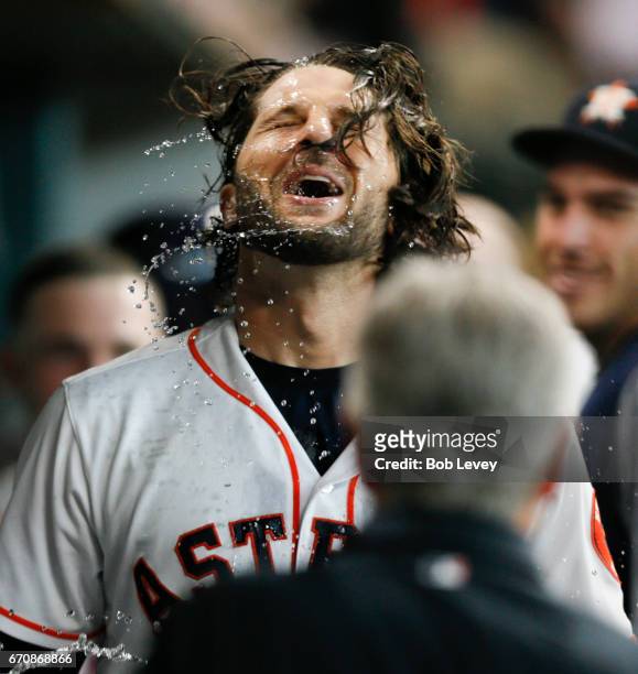 Jake Marisnick of the Houston Astros celebrates in the dugout after hitting a home run in the fifth inning against the Los Angeles Angels of Anaheim...