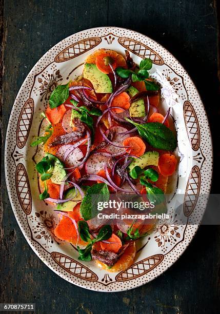 orange and avocado salad on serving dish - serving dish stock pictures, royalty-free photos & images