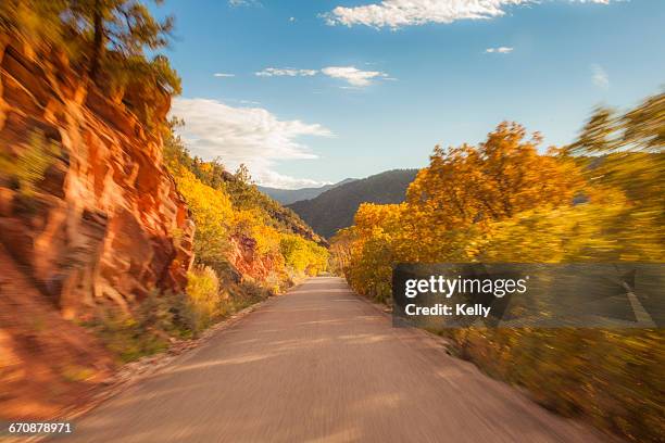 colorado, new castle, empty country road at sunset - new castle colorado stockfoto's en -beelden