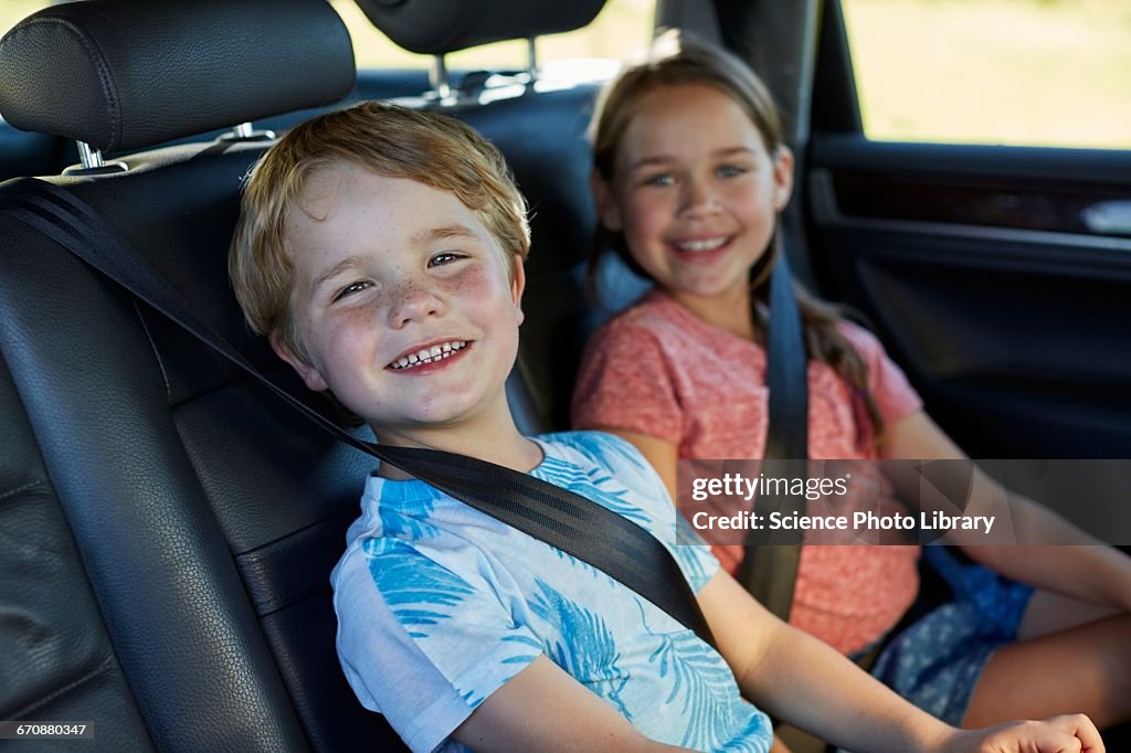 Brother and sister in car