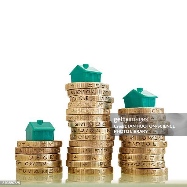 british pound coins with model houses - british library stock pictures, royalty-free photos & images