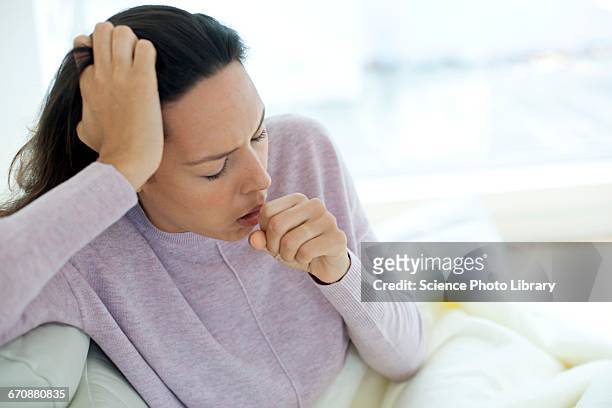 young woman coughing - husten stock-fotos und bilder