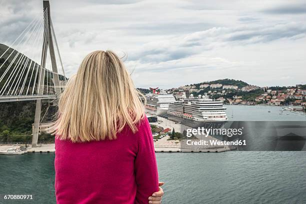 croatia, dubrovnik, back view of woman looking to the harbour - moored stock pictures, royalty-free photos & images