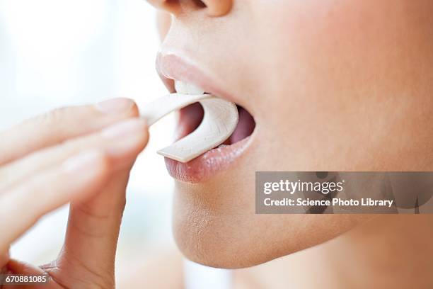 young woman chewing gum - kauwen stockfoto's en -beelden