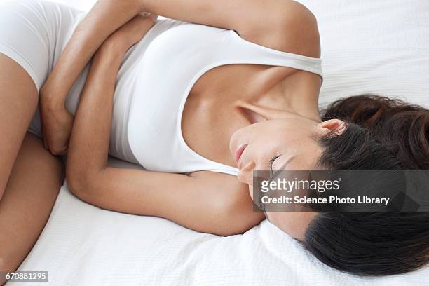 young woman with stomach cramps - pms stock pictures, royalty-free photos & images