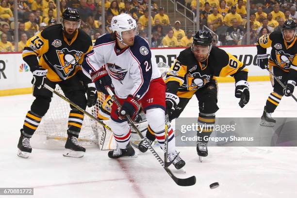 Brandon Saad of the Columbus Blue Jackets controls the puck in front of Trevor Daley of the Pittsburgh Penguins during the first period in Game Five...