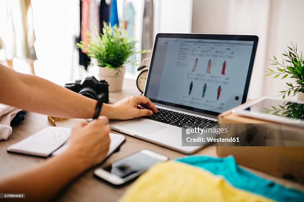 Creative professional using laptop at desk