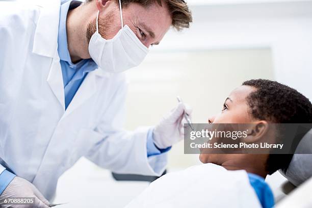 boy having oral check-up - dentista bambini foto e immagini stock