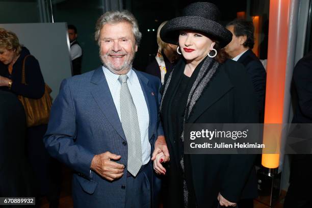 President of the Cartier Fondation Alain Dominique Perrin and French actress Catherine Jacob attend 'Auto Photo' Exhibition Preview at Fondation...