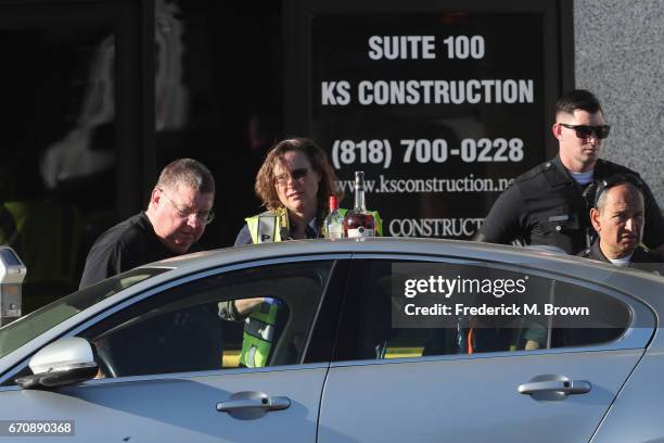 Police search the car where singer Cuba Gooding Sr. Was found dead on April 20, 2017 in Woodland Hills, California. Gooding was 72 years old.