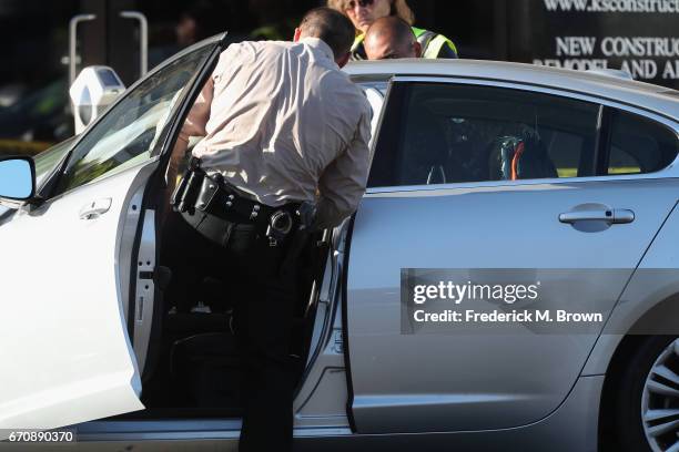 Police search the car where singer Cuba Gooding Sr. Was found dead on April 20, 2017 in Woodland Hills, California. Gooding was 72 years old.
