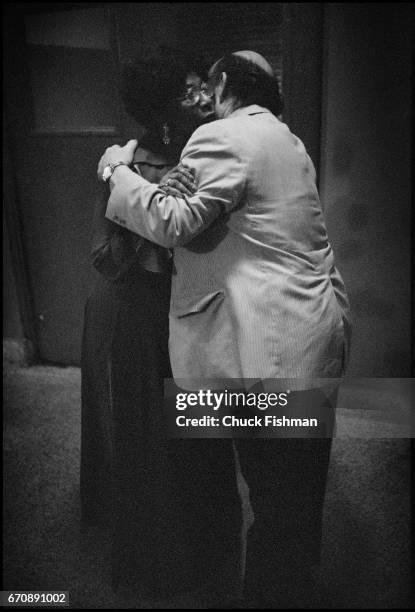 Backstage at the New Orleans Jazz Festival, American Jazz musician Ella Fitzgerald hugging festival producer George Wein backstage, New Orleans,...