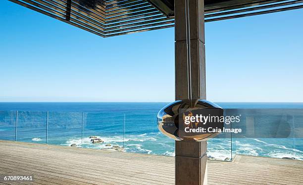 hanging fireplace on modern luxury patio with ocean view - beach house balcony fotografías e imágenes de stock