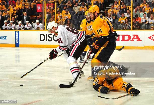 Subban of the Nashville Predators slides into teammate Mattias Ekholm as they try to defend against Marian Hossa of the Chicago Blackhawks during the...