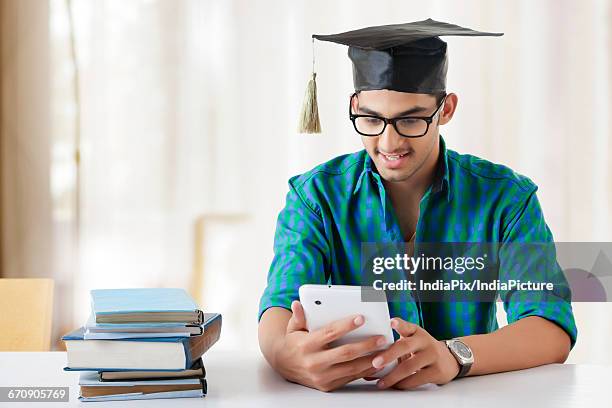 Using Graduate Devices 128 Graduate Using Tablet Stock Photos, High-Res Pictures, and Images ...