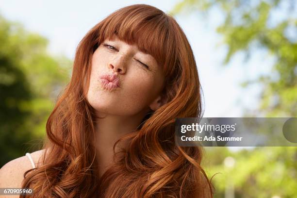 redhead having fun outside - bangs fotografías e imágenes de stock