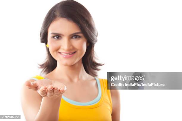 woman holding something from her hand - hands cupped empty ストックフォトと画像