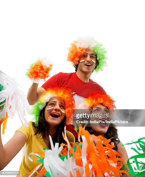 youngsters with wigs cheering - tricolor fotografías e imágenes de stock