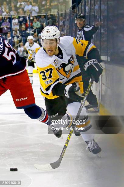 Carter Rowney of the Pittsburgh Penguins controls the puck in Game Four of the Eastern Conference First Round during the 2017 NHL Stanley Cup...