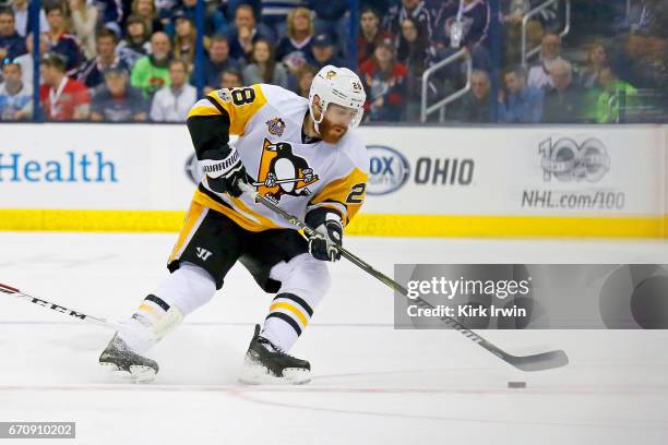 Ian Cole of the Pittsburgh Penguins controls the puck in Game Four of the Eastern Conference First Round during the 2017 NHL Stanley Cup Playoffs...