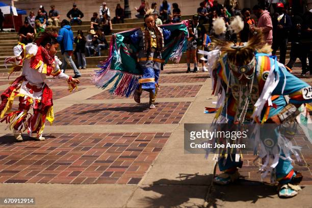 April 20: 7 year old Phoenix White Face and Sunshine Yellow Horse, Oglala Lakota both of the Pine Ridge Indian Reservation dance with Robert Iron...