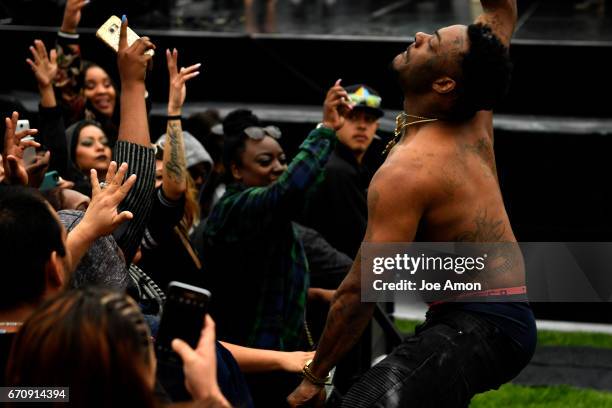 April 20: A visiting rapper gets the attention of the ladies during one of his songs at the Denver 420 Rally at Civic Center Park in downtown Denver....